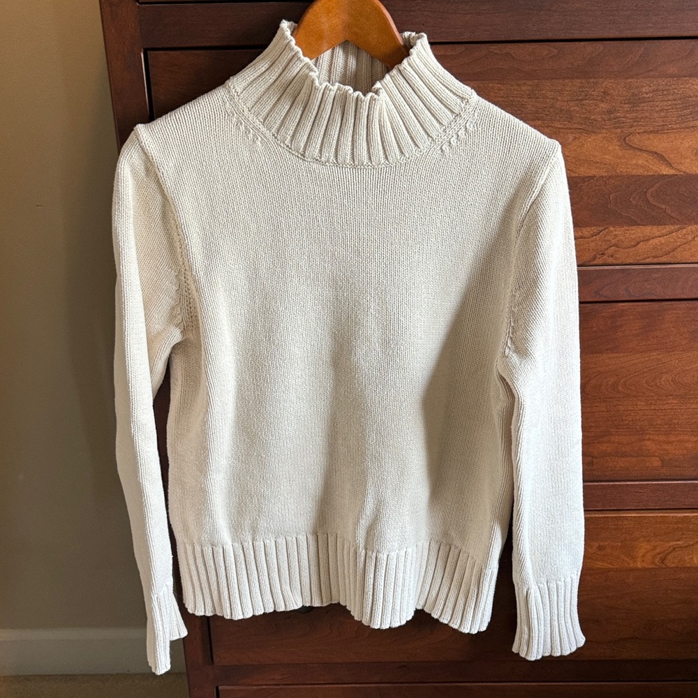 J. Crew Cream colored cotton turtleneck sweater.
